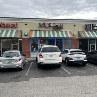 cars parked in front of the restaurant