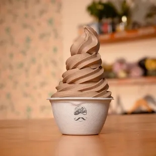 a cup of ice cream on a table