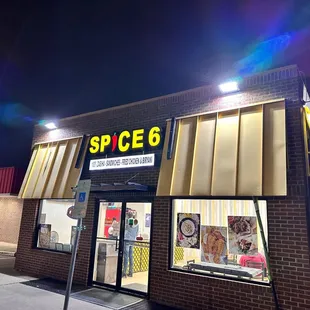 the exterior of a store at night