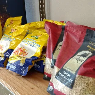 a shelf of spices and rice