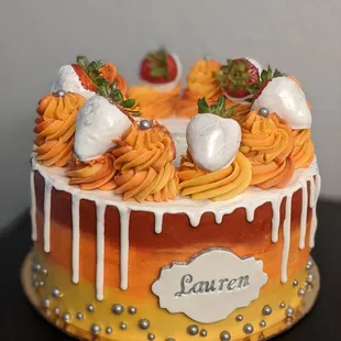 a cake with icing and strawberries