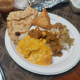 Butter chicken, goat curry, basmati rice, naan, samosas, aloo tikki.