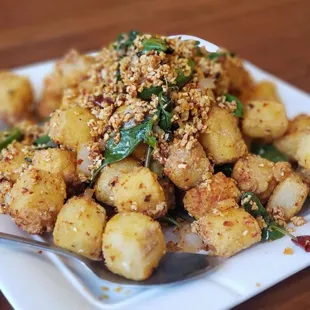 Fried tofu snowed with fried garlic (vegan). Hella good.