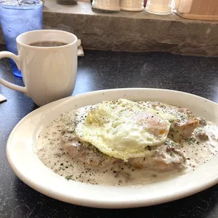 Cup of coffee with the biscuits and gravy.