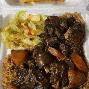 Oxtails, peas/rice, cabbage and beef patty