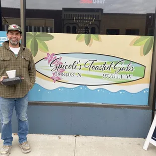 a man standing in front of a store