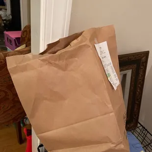 a brown paper bag on a chair