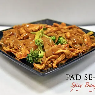 a plate of noodles and broccoli