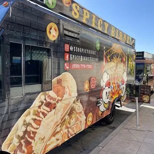 a food truck parked on the side of the road