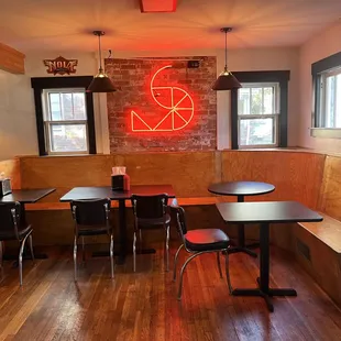 a restaurant with a neon sign