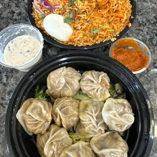 Chicken momo dumplings, raita, spicy dipping sauce and chicken biryani! Yum!