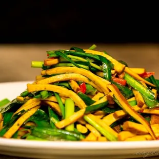 a plate of stir fried vegetables