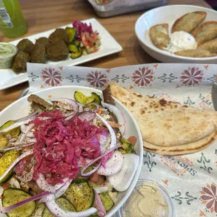 Mediterranean bowl, falafel, and samosas.