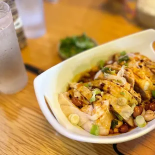 a bowl of food and a drink