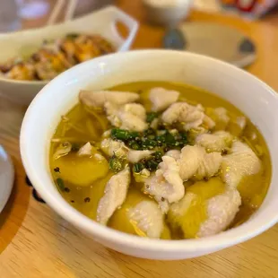 a bowl of soup and a plate of food