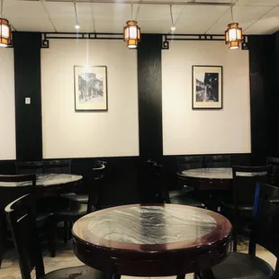 a dining area with tables and chairs