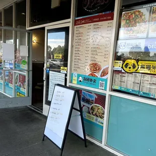 a sign in front of a restaurant