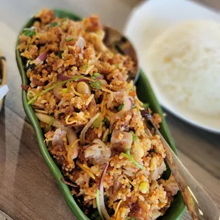 a dish of fried rice and vegetables