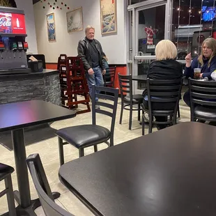 Five tables on each side of the restaurant