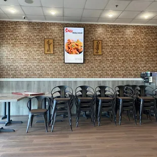 a brick wall and tables