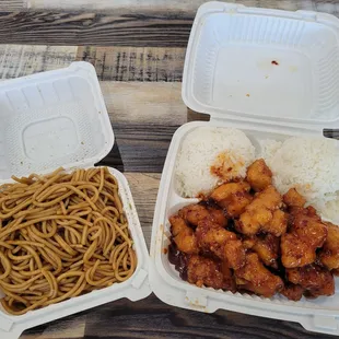 two takeout containers of food