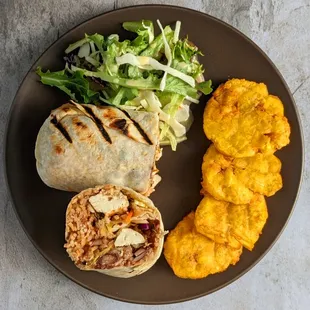 Burrito made with diced tofu marinated in spicy jerk seasoning and grilled to perfection. Served w/ plantains and salad.