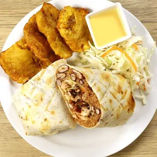 A diced jerk chicken burrito, with rice, kidney beans, and cabbage salad. Served with savory plantains an salad.