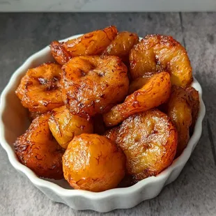 Side of delicious sweet plantains cooked in a way that carmelizes the sugar. Makes a great dessert.