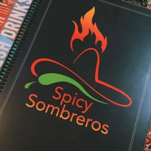 a cookbook and cookbooks on a table