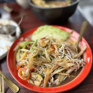 a plate of noodles and vegetables