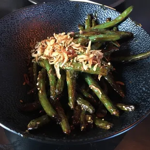 a bowl of stir fried green beans