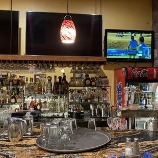 a bar with a variety of drinks