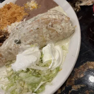 Steak Chimichanga smothered in queso!