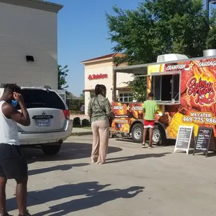 A long line at Spicy Tails food truck  in Little Elm.