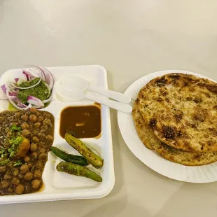 a plate of food and a plate of bread
