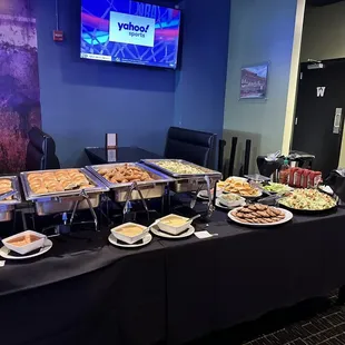 a buffet table full of food