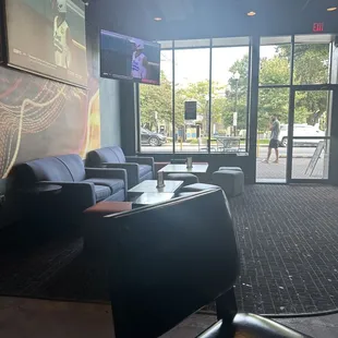 a view of a large screen in a lobby