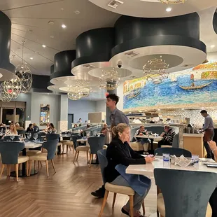 Some of the room and the kitchen.