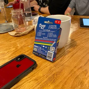 a young boy sitting at a table with his family