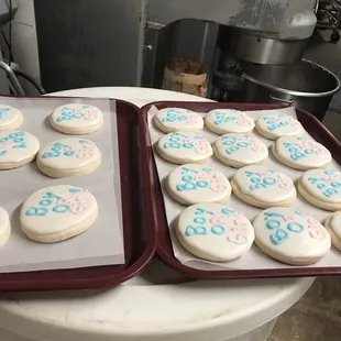 two trays of decorated cookies