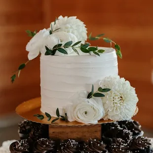 a wedding cake with white flowers