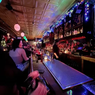 a woman sitting at a bar