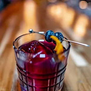 Blueberry Old Fashioned featuring Elijah Craig Rye  and house-made blueberry simple syrup