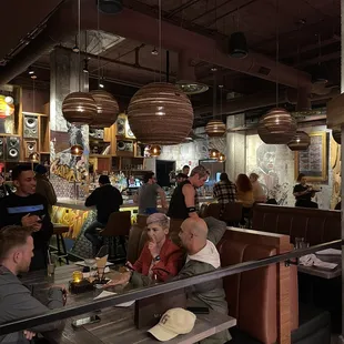 a group of people eating at a restaurant