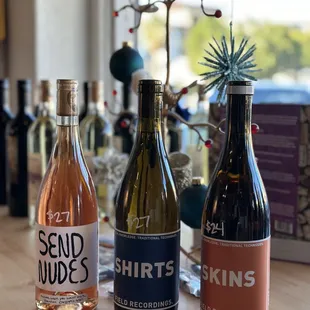 three bottles of wine on a table
