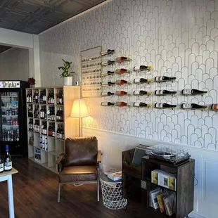 a living room with a wine rack on the wall