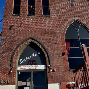 the front entrance of a brick building