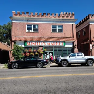 a pickup truck parked in front of the store