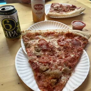 Meat lovers pizza and beverages