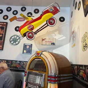 An old coca-cola petal car &amp; old juke box!!!